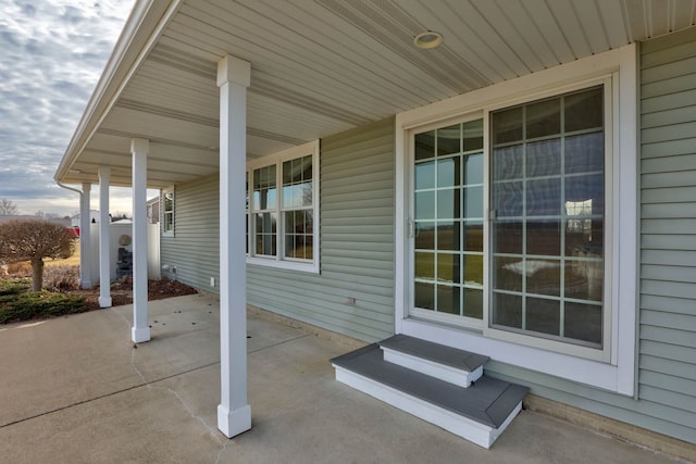 view of patio featuring entry steps and a porch