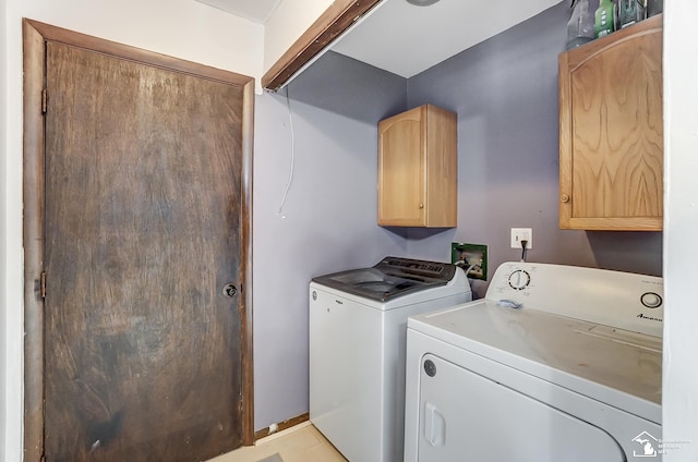 laundry area with cabinet space and washing machine and clothes dryer