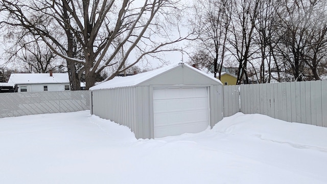 exterior space featuring a garage and fence