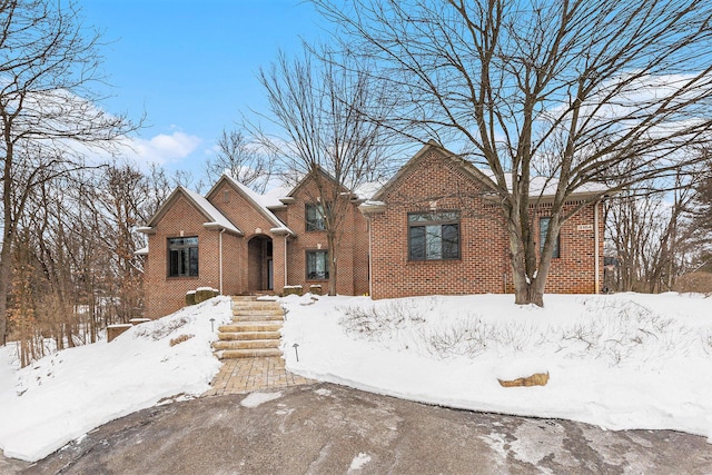 view of front of home featuring brick siding