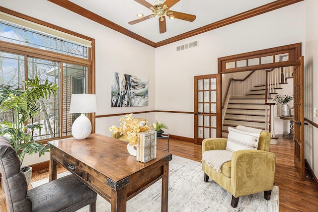 home office with baseboards, visible vents, a wealth of natural light, and wood finished floors