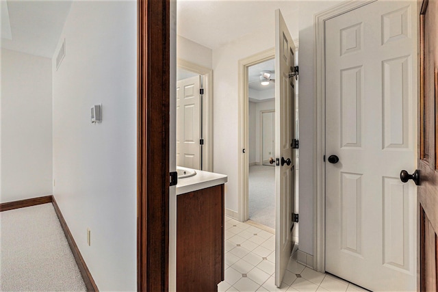 bathroom featuring vanity and baseboards