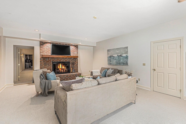 living area featuring light carpet, recessed lighting, a fireplace, and baseboards