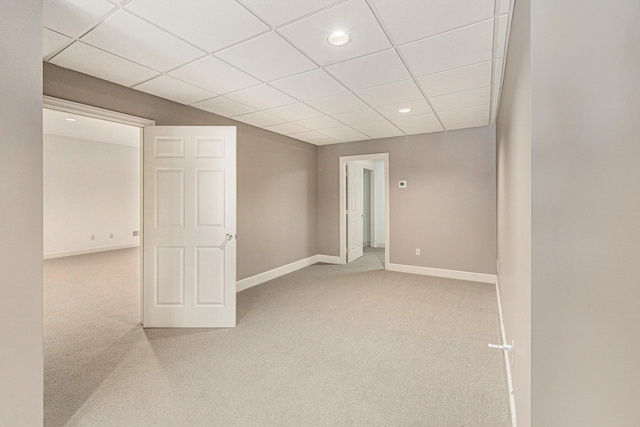 basement with baseboards, a drop ceiling, carpet flooring, and recessed lighting