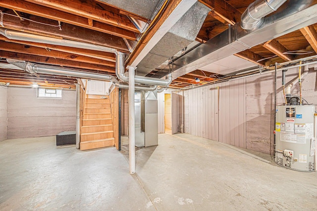 basement featuring water heater and heating unit