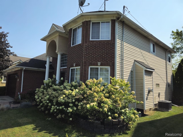 45 Forthton Dr, Troy, MI 48084 - view of home's exterior with a garage, brick siding, and a yard