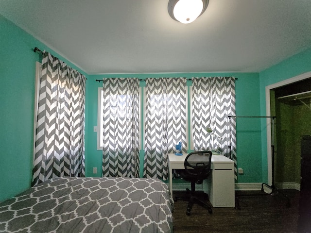 bedroom featuring wood finished floors