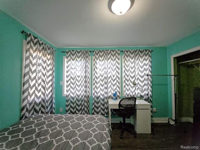 45 Forthton Dr, Troy, MI 48084 - bedroom with multiple windows, a desk, and dark wood-style flooring