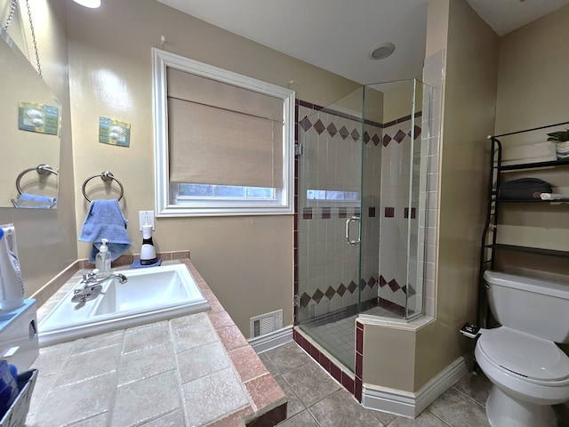 full bathroom with visible vents, a stall shower, a sink, tile patterned flooring, and baseboards