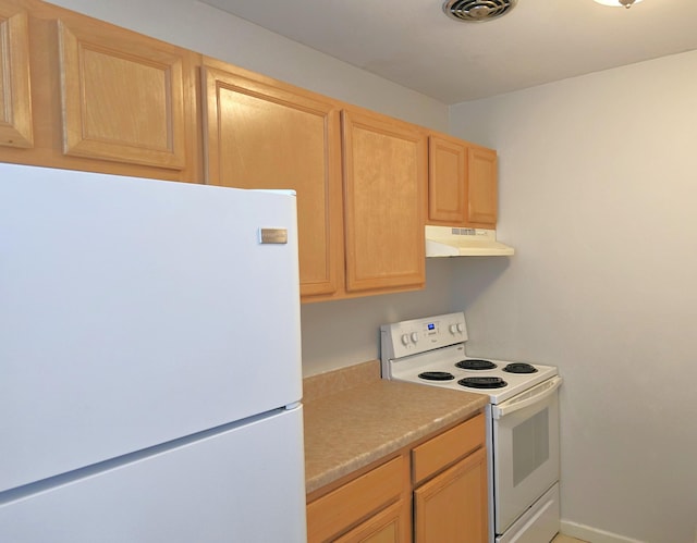 kitchen featuring light brown cabinets, under cabinet range hood, white appliances, visible vents, and light countertops