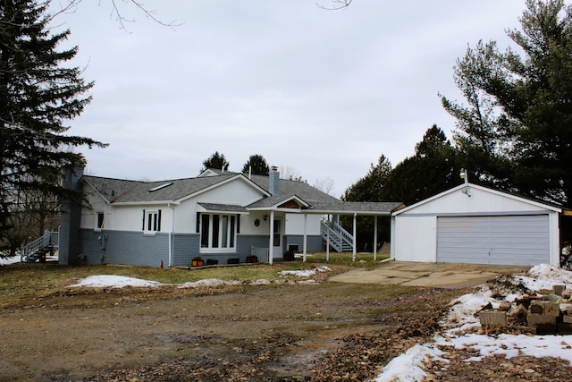 ranch-style house with a chimney, an outdoor structure, and a detached garage