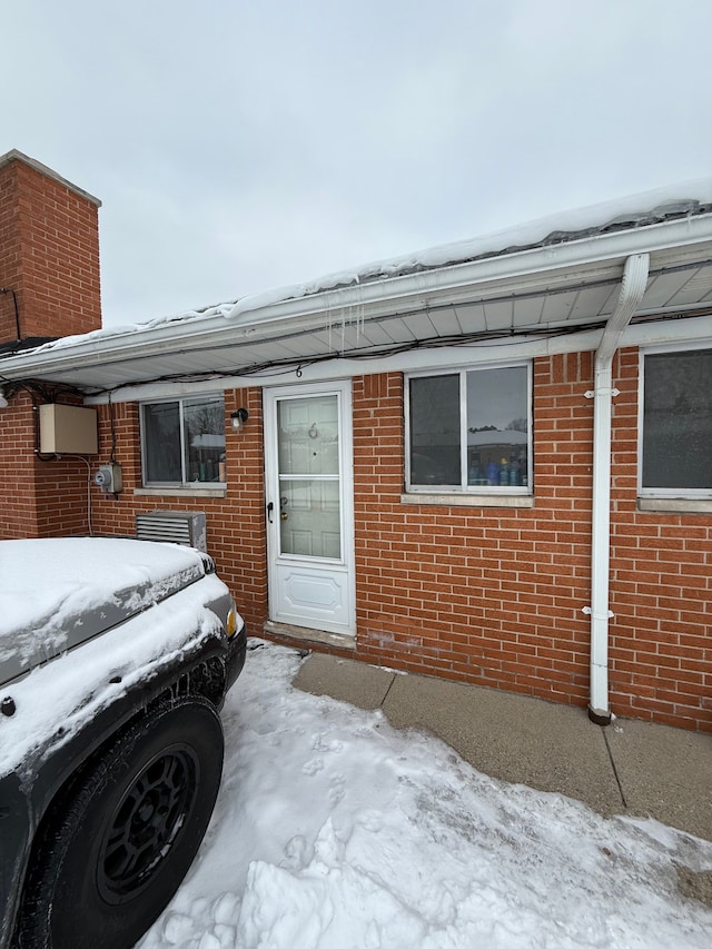 exterior space featuring brick siding