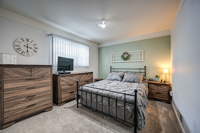 carpeted bedroom featuring visible vents