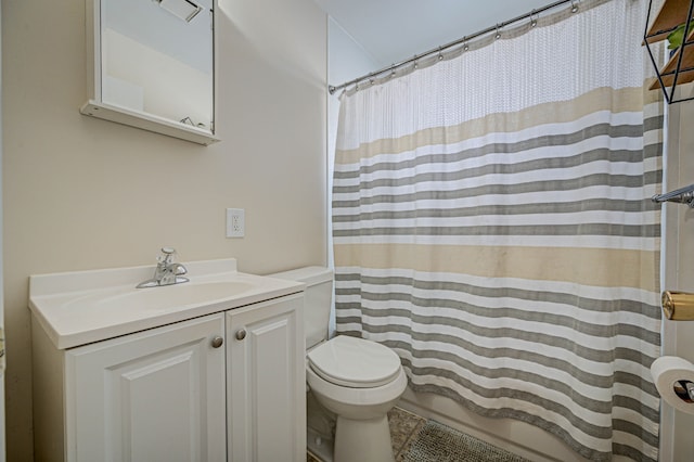 bathroom with toilet, vanity, and a shower with curtain