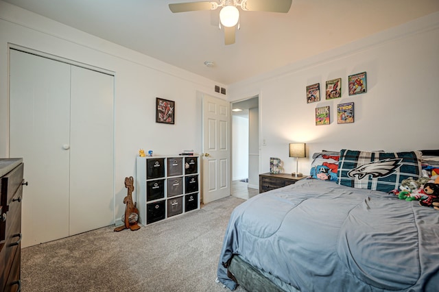 bedroom featuring ceiling fan, carpet floors, a closet, and visible vents