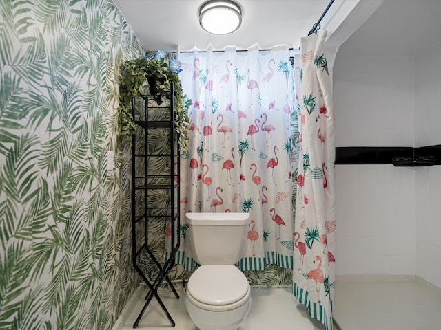 bathroom with toilet and curtained shower