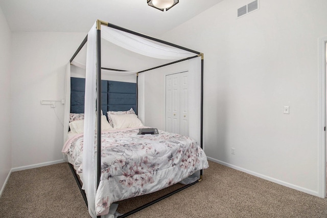 carpeted bedroom with a closet, visible vents, and baseboards