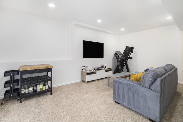 living room with recessed lighting, light colored carpet, and baseboards