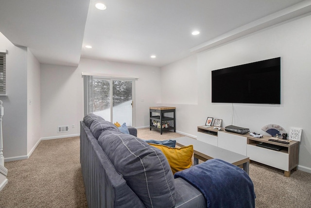 carpeted living room featuring baseboards, visible vents, and recessed lighting