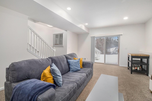 carpeted living room featuring stairway, baseboards, and recessed lighting