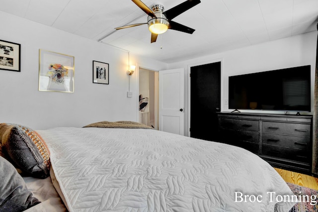 bedroom featuring a ceiling fan and wood finished floors