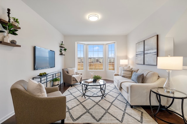 living room featuring wood finished floors and baseboards