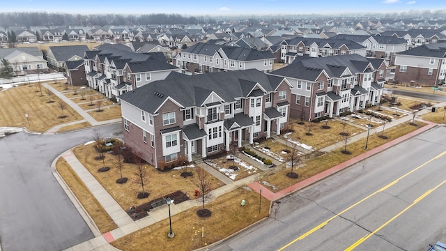 birds eye view of property with a residential view