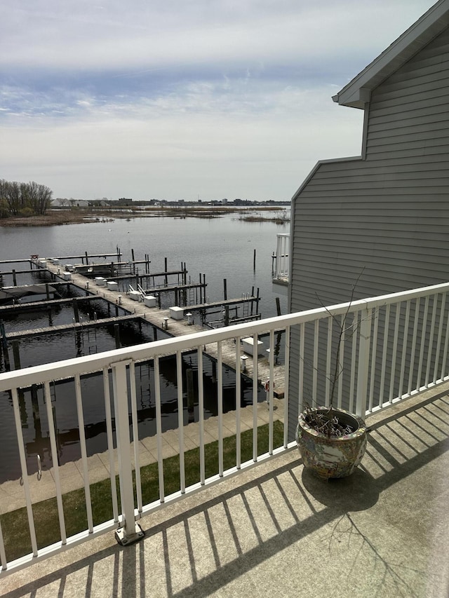 2411 Lake Ave Unit 36, Muskegon, MI 49445 - balcony with a water view, boat lift, and a dock
