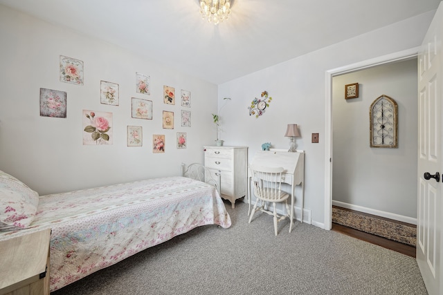 carpeted bedroom with baseboards