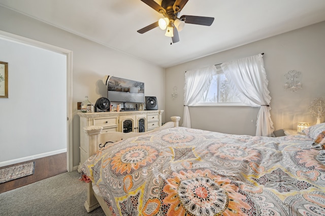 bedroom with ceiling fan, carpet, and baseboards