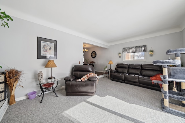 carpeted living room featuring a chandelier and baseboards