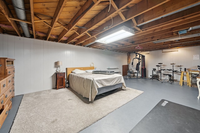 bedroom featuring concrete flooring