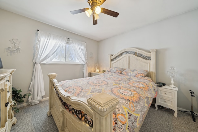 bedroom featuring dark carpet, a ceiling fan, and baseboards