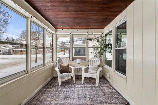 unfurnished sunroom with wooden ceiling