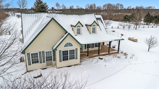 view of snow covered house