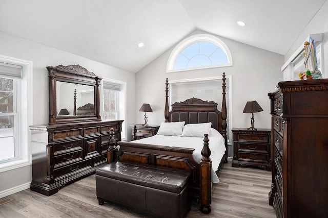 bedroom with light wood-type flooring, baseboards, vaulted ceiling, and recessed lighting