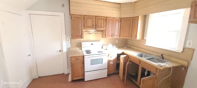 kitchen featuring white electric stove, light countertops, and a sink