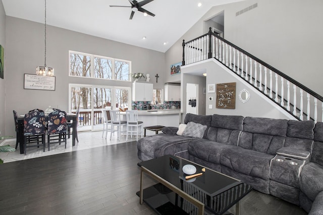 2839 Davista Dr, Highland, MI 48356 - living room with ceiling fan, high vaulted ceiling, wood finished floors, a chandelier, and recessed lighting