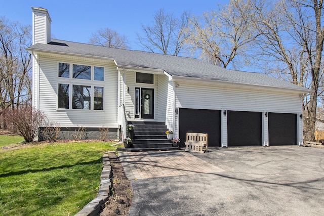 2839 Davista Dr, Highland, MI 48356 - view of front of property with driveway, a garage, a chimney, a front yard, and a shingled roof