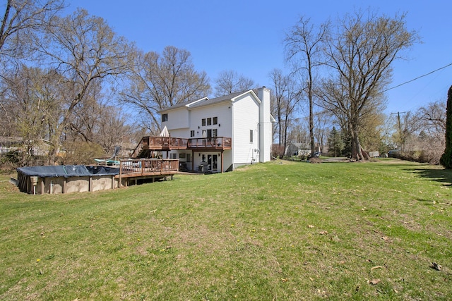 2839 Davista Dr, Highland, MI 48356 - view of green lawn featuring a deck and a covered pool
