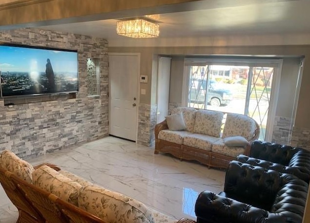 living room featuring marble finish floor