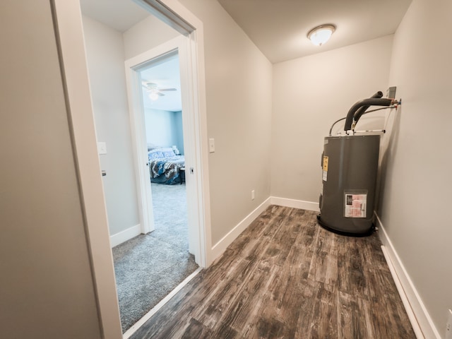 utility room featuring water heater