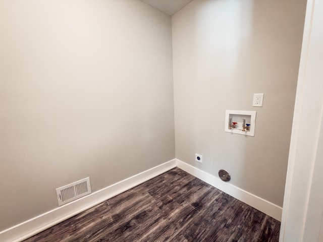 clothes washing area featuring hookup for a washing machine, hookup for an electric dryer, laundry area, visible vents, and baseboards