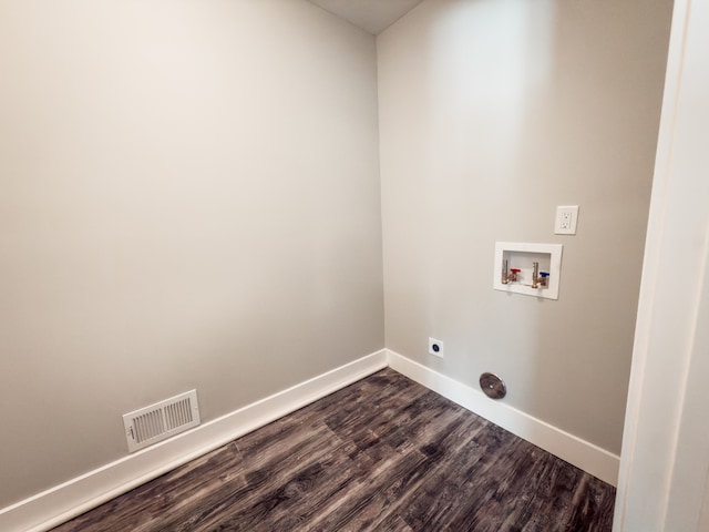 4614 Quigley Rd, Alger, MI 48610 - washroom featuring dark wood-type flooring, electric dryer hookup, hookup for a washing machine, and baseboards