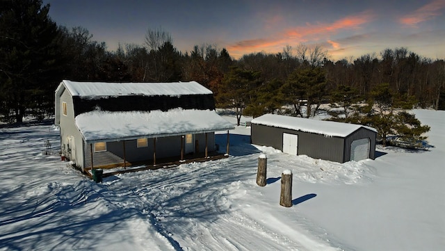 exterior space with a garage and an outdoor structure