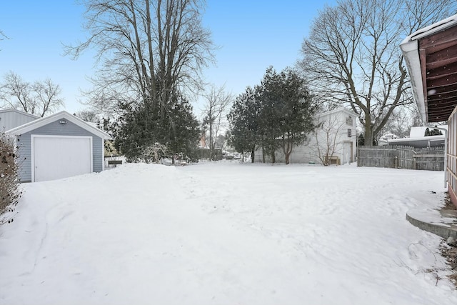 snowy yard with fence