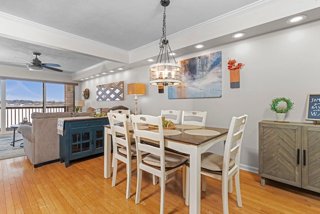 dining space featuring light wood finished floors, a ceiling fan, crown molding, and recessed lighting