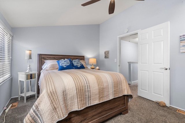 bedroom with baseboards, visible vents, dark carpet, and a ceiling fan