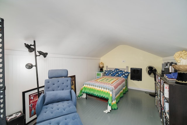 bedroom with lofted ceiling and dark wood-style floors