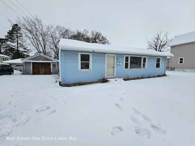 view of front of home with an outbuilding and a garage